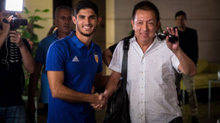 Guedes y Peter Lim