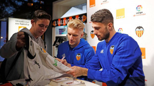 Wass y Piccini firmando autógrafos
